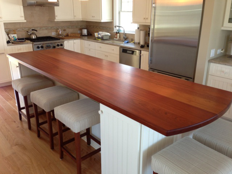 1.5" thick Jatoba (Brazilian Cherry) flat grain countertop with small Roman ogee edge treatment and food safe mineral oil