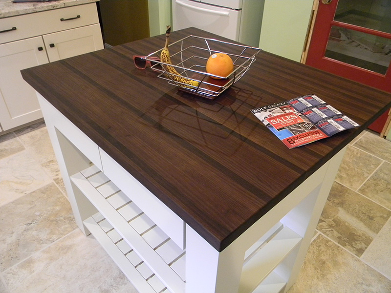 1.5" thick Peruvian Walnut edge grain countertop with 1/8" roundover edge treatment and food safe mineral oil 