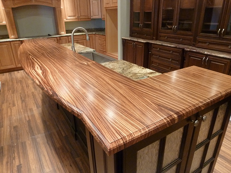1.5" thick Zebrawood flat grain countertop with ogee with notch edge treatment and permanent finish.